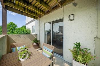 Private covered patio with outdoor seating